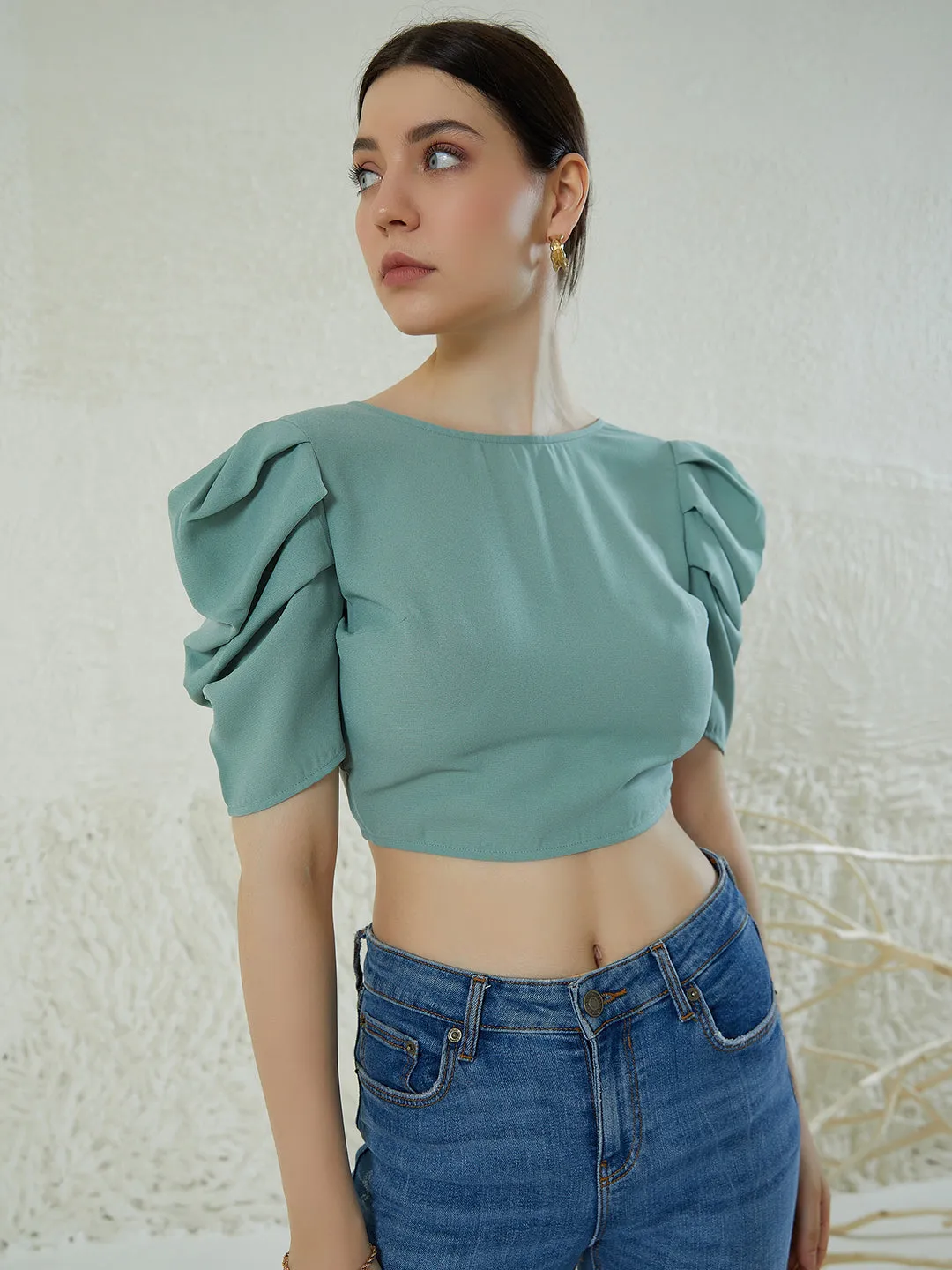 Berrylush Women Solid Green Round Neck Puff Sleeves Styled Tie-Up Back Crepe Cropped Top