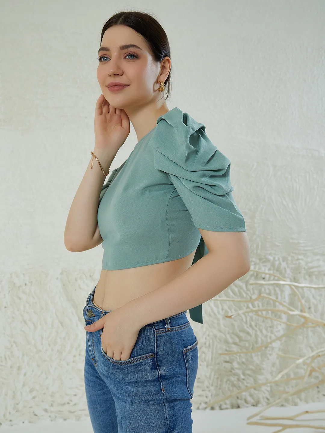 Berrylush Women Solid Green Round Neck Puff Sleeves Styled Tie-Up Back Crepe Cropped Top
